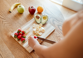 Image showing Health, diet and healthy woman cutting fruit to make a smoothie with nutrition for an organic meal at home. Closeup of caucasian female hands chopping fresh produce for a health in a kitchen.