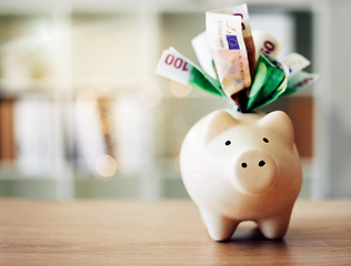 Image showing . Banking, finance and paper money in piggybank for future savings, budget and profit on a table for wealth. Closeup of a tool to save European cash notes, investment and financial growth on a desk.