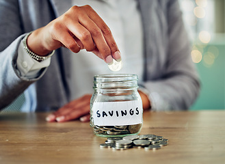 Image showing . Savings jar, money coins and change of a woman hand holding and saving cash to budget. A female planning investment, retirement and financial security. Closeup of financial growth for the future.