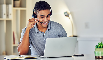 Image showing Call center telemarketing agent with headset and laptop working, assisting or talking to online web user. Male sales representative advisor with excellent customer service skills and business advice