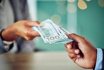 Image showing Hands, dollars and businessmen exchanging cash at a bank, making a purchase or deal. Closeup of money, investment and business doing its accounting. African entrepreneur paying for a service or loan.