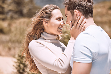 Image showing Love, romance and dating with an affectionate young couple standing face to face and sharing an intimate moment while outside on a date. Man and woman loving, spending time together and bonding