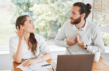 Image showing Stress, finance and arguing couple talking about budget, home loan and bills while sitting with tax papers and laptop . Man and woman with problem upset about bad financial debt and mortgage payment