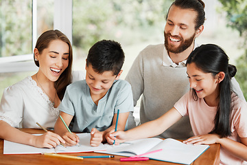 Image showing Learning, education and homework with a family writing, drawing and studying together on a table at home. Parents and children bonding and spending time together while feeling happy and carefree