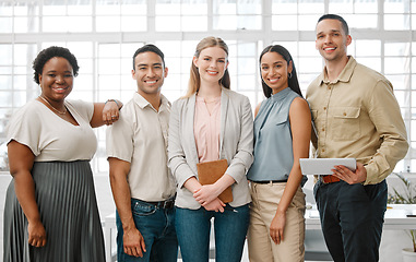 Image showing Happy, smiling and diverse team of business people standing in unity, supporting and working together in a modern office at work. Portrait of workers, employees and colleagues planning a project