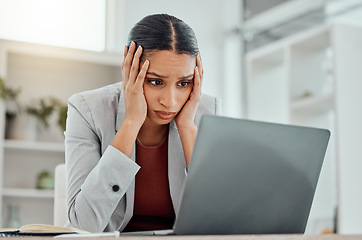 Image showing Pain, headache and stressed finance manager feeling sick, tired and worried about a financial problem at her startup company. Young and frustrated professional businesswoman working at an office