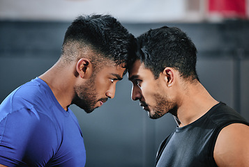 Image showing Healthy, serious and fit male athletes staring, facing and looking ready before a fight. Strong young men in an active challenge, a battle of power against strength and a motivation for winning.