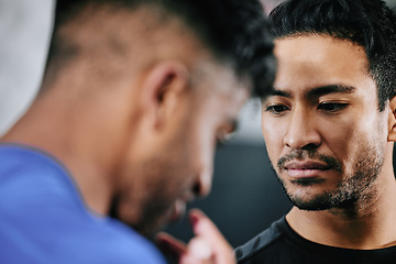 Image showing Angry, aggressive and fight with a young man fighting, showing aggression and being upset while arguing or fighting. Conflict, disagreement and dispute with two bad, negative and disgruntled men