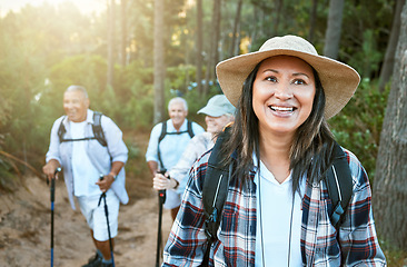 Image showing . Hiking, adventure and exploring with a senior woman and her retired friends on a hike outdoors in nature. Enjoying a walk or journey of discover in the forest or woods for leisure and recreation.