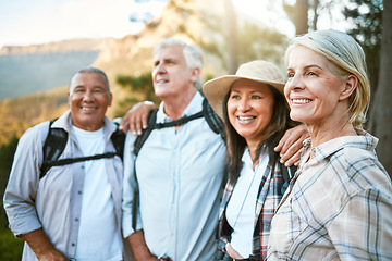 Image showing Hiking, adventure and exploring with a group of senior friends and retired adults enjoying a hike or walk outdoors in nature. Enjoying the view while on a journey of discovery in the forest or woods