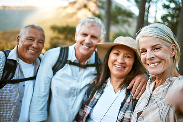 Image showing Hiking team taking a selfie in the natural woods, mountains and forest outdoors together in nature. Healthy, happy and senior couples outside on holiday to keep active, friendship and fit on a hike