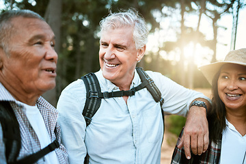 Image showing Hiking, adventure and exploring with a group of senior friends and retired adults enjoying a hike or walk outdoors in nature. Enjoying the view while on a journey of discovery in the forest or woods