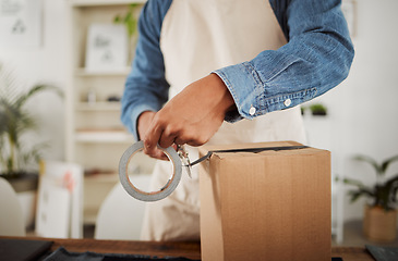 Image showing Packing, packaging and boxing product by wrapping in sticky or duct tape and ready for shipping, selling or delivery. Closeup small business owner hands sealing package, order or gift for courier