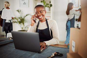 Image showing . Designer talking on phone call, taking orders on laptop and working at a factory, fashion boutique or studio at work. Smiling and happy tailor, worker or stylist making conversation with supplier.