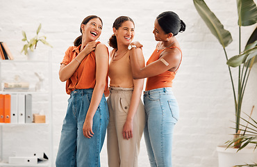 Image showing Female friends after receiving covid vaccine, happy and smiling, approving the immunity injection showing bandage plaster arms. Diverse women recommend booster jab for protection from corona virus.