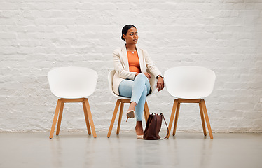 Image showing Employment, hiring and recruitment with young woman sitting on a chair waiting for her interview with HR in a creative office. Female shortlist candidate ready for her meeting or appointment