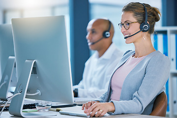 Image showing Call center agent, telemarketing sales and customer service operator smiling while working on a computer and talking to a customer. Sales representative happy to help and answer calls for support