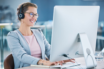 Image showing Call center, customer service and agent with computer talking to customers, helping and answering office calls. Mature, happy and friendly helpdesk operator, secretary and contact us client support