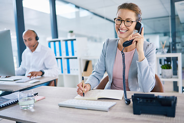 Image showing Smiling receptionist, business woman or customer service employee consulting on phone in telemarketing call center office. Happy corporate or crm support manager working in contact us helpdesk