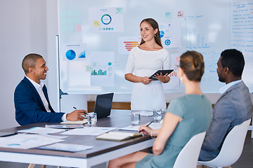 Image showing Presentation, training and learning workshop in a boardroom with a female leader talking to her team during a meeting. Teamwork, strategy and collaboration with a group of people working together