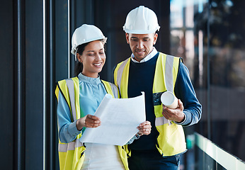 Image showing Architect, construction engineers and builder partners with building blueprints planning together. Contractor colleagues in collaboration on development of engineering design plans for future project