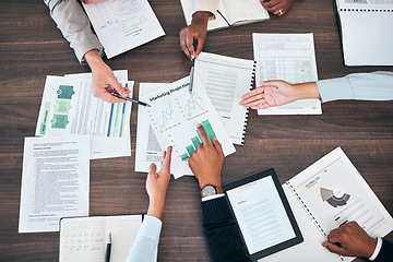 Image showing Business teamwork hands in a sales, marketing and forecasting projection meeting or group discussion about company strategy for growth development. Top view of people looking at chart, graph and data