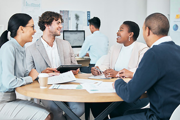 Image showing Diverse business marketing team enjoying casual chat during meeting in modern office, smiling and laughing. Happy colleagues planning and sharing idea or goal while discussing a strategy for startup