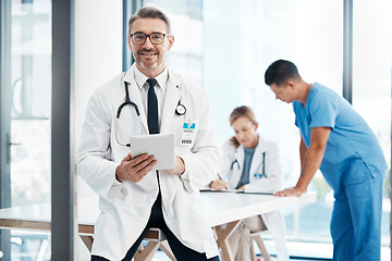 Image showing Technology, innovation and new medicine with expert science working in the healthcare field. Medical doctor, happy and using tablet in the boardroom after a meeting at a hospital, team in background