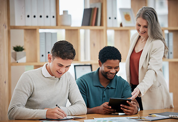 Image showing Mentor, leader or HR manager training employees or talking to interns in an office helping them with work. Happy female senior corporate professional satisfied by trainee project