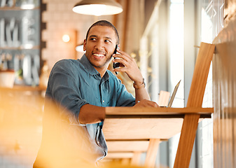 Image showing Male entrepreneur working in a coffee shop, restaurant or cafe talking on a phone call. Happy and young freelance worker doing remote work planning on a mobile conversation