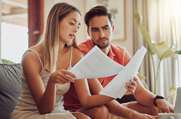 Image showing Budget, debt and mortgage with a couple reading bills and documents while checking their expenses and savings. Husband and wife looking worried while reading a loan application or contract together