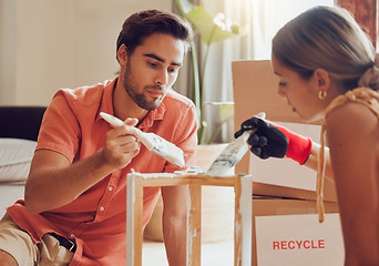 Image showing Couple painting or decorate wooden table or chair by recycle and thrift furniture for a home improvement project in apartment. Creative and DIY man and woman with reusable objects in their house