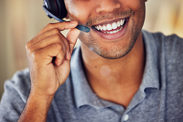 Image showing . Happy, smiling and friendly call center agent wearing headset while working in an office. Closeup smile of a confident man consulting and operating helpdesk for customer sales and service support.