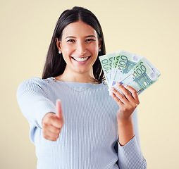 Image showing Thumbs up, money and finance growth with cash, bank notes and currency after investment, savings and lottery win. Portrait of excited, happy or motivated woman approving wealth, budget or development