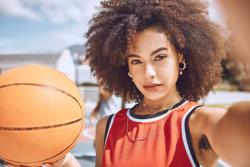 Image showing Cool selfie of basketball player with funky, confident and hipster attitude ready for game, fun or playing outdoor sport match. Portrait of young, beautiful and black woman with afro hair on court