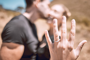 Image showing Engagement, proposal and romance while showing off her diamond ring and saying yes to marriage outside. Closeup hand of a young romantic couple telling you to save the date for their wedding day