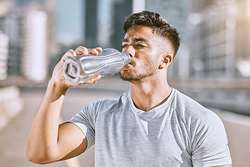 Image showing Drinking water, fit and healthy man living an active health, wellness and body or weight watching lifestyle. Athletic running, fitness and sports lover staying cool after workout or training routine