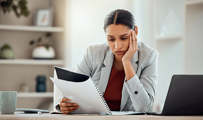 Image showing Bored, thinking professional businesswoman reading and managing company financial crisis strategy report. Stressed employee working on investment loss of economy market shares of company