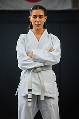 Image showing . Karate pro, women empowerment and training mindset of a serious, learning sport student. Portrait of a fight and fitness athlete with focus in a sports studio, dojo school or martial arts gym.