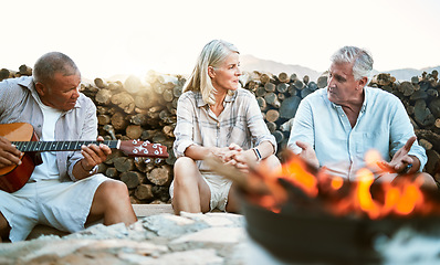 Image showing . Senior, adventure and fun wellness hiking group of friends, relaxing or taking a break by the campfire after walking on outdoors mountain trip. Elderly explorers resting on camping getaway trip.
