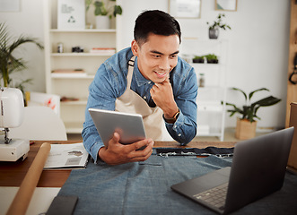 Image showing Fashion designer planning online for product order, startup logistics and creative industry in a studio. Happy man, small business owner and stylist planning on laptop and browsing on digital tablet