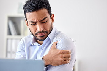 Image showing Bad muscle pain in the arm, shoulder and body after an injury and ache while working in the office. Angry, upset and frustrated businessman with a painful strain, hurt and sore sitting at his desk