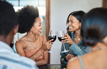 Image showing Friends having fun and drinking wine, toasting, bonding and celebrating at an event or party. Diverse friends cheers and laughing, enjoying free time, dining experience and wine tasting gathering