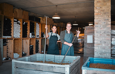 Image showing Wine making, production and cellar workers crush, blend and stir open tank for alcohol process. Portrait of happy staff in factory and winery industry for distillery and manufacturing warehouse