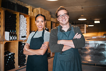 Image showing Proud, confident and happy wine business owner standing with arms crossed in a cellar. Portrait of leader, ceo or management of a startup agriculture company. Success , vision and ambition for growth