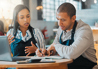 Image showing Small business owners discussing and planning startup growth, budget and expenses in the cafe or coffee shop. Entrepreneurs having a financial discussion about the business finance strategy