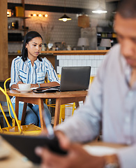 Image showing Working, reading and typing in a coffee shop with a digital worker writing an email on a computer. Job, career focus of a woman startup entrepreneur or digital web writer in a cafe or restaurant