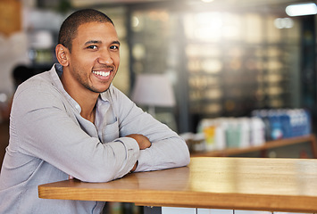 Image showing Entrepreneur or small business owner of cafe or coffee shop at counter happy and smiling. Young, confident and successful boss, manager or leader of a hospitality startup restaurant, bistro or store