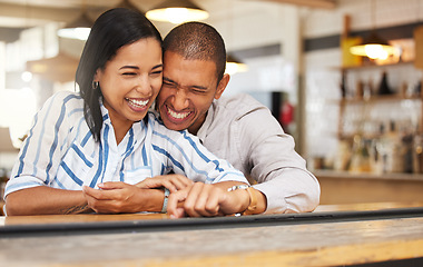 Image showing Couple laughing at funny joke at restaurant, boyfriend and girlfriend bonding with smile on romantic date and celebrating anniversary at coffee shop. Husband and wife showing love, having fun at cafe