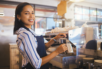 Image showing Barista preparing drink in coffee shop, cafe startup and hospitality restaurant. Portrait of friendly waitress, happy bistro worker and young woman steaming milk for hot cappuccino and waiter service